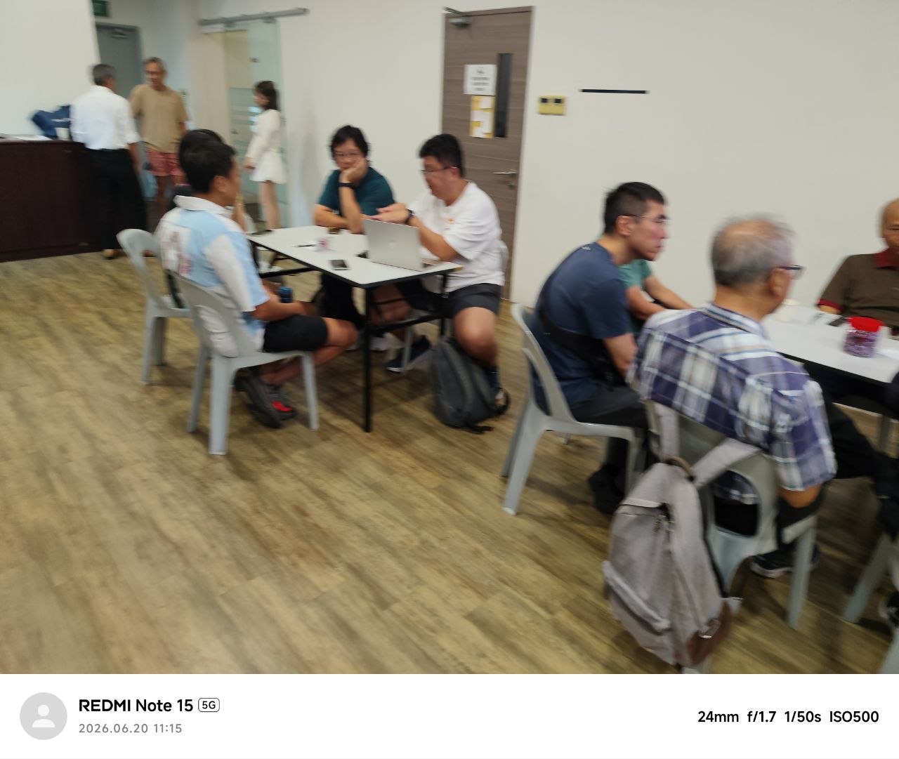 PMETs in a workforce transition workshop, working together around tables